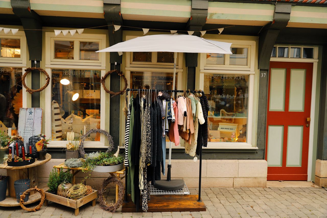 Crafting Captivating Headlines: Your awesome post title goes here Charming timber-framed storefront in Hann. Münden with clothing and decor display.